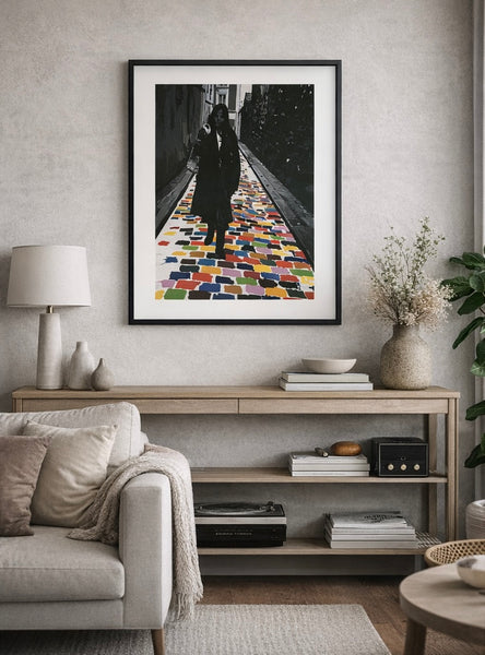 Living room with a framed artwork on the wall, a sofa, and a coffee table.