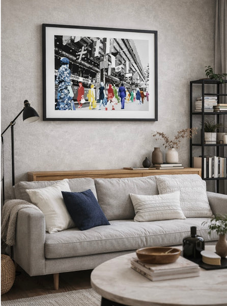Living room with a gray sofa, framed artwork, and decorative items.