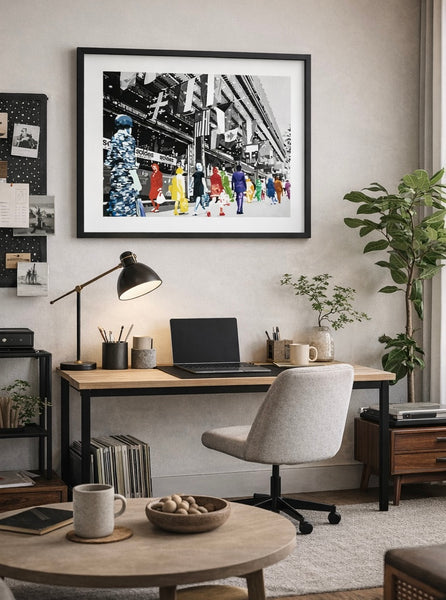 Home office with a desk, chair, and framed artwork on the wall.